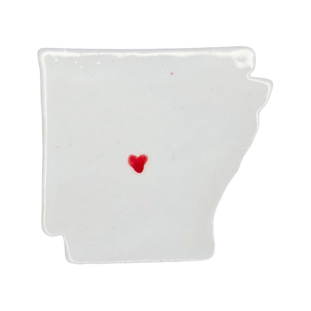 Handmade Arkansas state ceramic magnet with red heart, custom personalized souvenir on white background