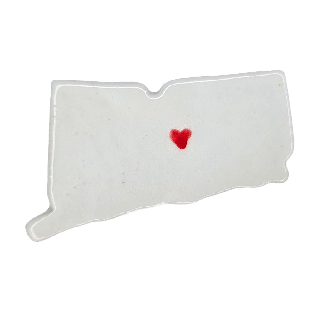 Handmade Connecticut state ceramic magnet with red heart, custom personalized souvenir on white background